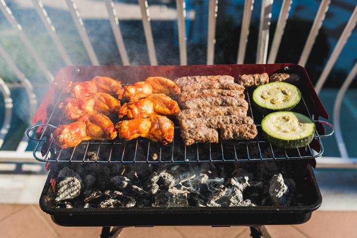 A BBQ is one of the best kitchen balcony ideas.