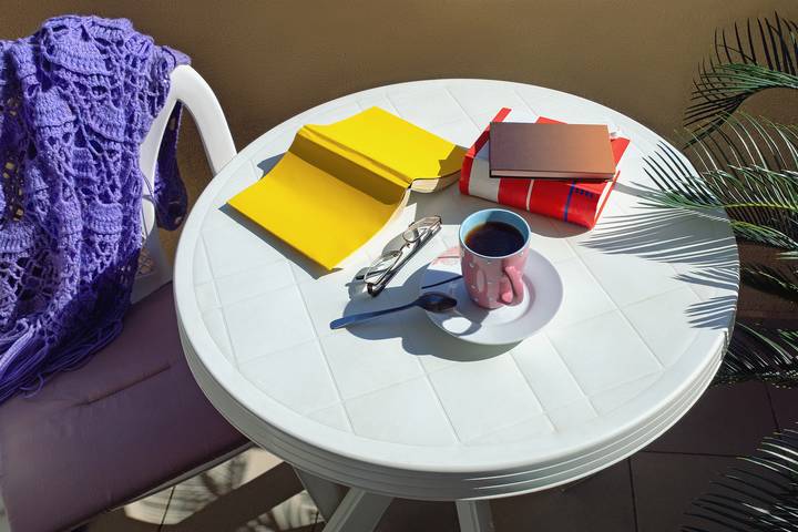 Use accessories and wall decor for condo balcony makeover ideas.