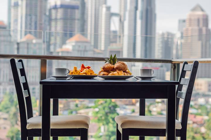 An outdoor kitchen is an excellent condo balcony makeover idea.