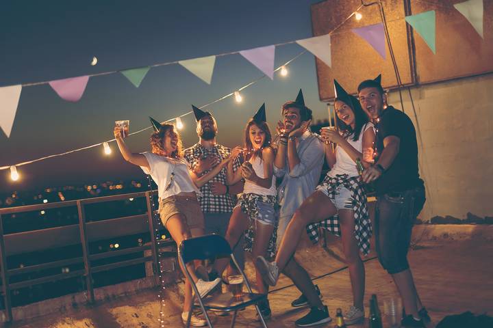Add lights for your condo balcony party ideas.